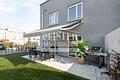 Neubaureihenhaus in Bamberg - großzügiges Wohnen mit guter Anbindung an München, Erlangen, Nürnberg - Terrasse mit Garten - (KI generiert)