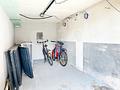 Zwei Wohneinheiten, Gartenanteil und drei Garagen – Wohnhaus in Kirchzell - Garage