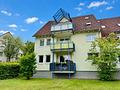 Gepflegte Maisonette-Eigentumswohnung mit 
Einbauküche, Garagenstellplatz, 2 Bäder & Balkon - Außenansicht