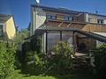 Doppelhaushälfte mit großer Terrasse und Dachstudio in Toplage von Maintal-Bischofsheim - Rückansicht