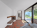 Außergewöhnlicher Split-Level-Bungalow mit Pool und Südwestgarten - Gartenzimmer mit Kamin und Zugang zur Terrasse