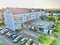 Gepflegtes Wohn- und Geschäftshaus
6 Wohnungen & 4 Gewerbeeinheiten
