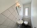 Hochwertige 3-Zimmer-Wohnung mit TG-Stellplatz und Gemeinschafts-Garten - Gäste-WC