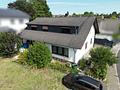 Schönes Zweifamilienhaus mit großer Einliegerwohnung auf großem Grundstück - Luftaufnahme 2