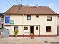 Vielseitiges Wohn- und Gewerbeensemble in Frankfurt-Schwanheim - Seitenansicht Haus 1