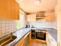 Zwei Wohneinheiten, Gartenanteil und drei Garagen – Wohnhaus in Kirchzell - OG_Küche