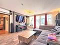 Haus-im-Haus: Großzügige Maisonettewohnung mit Dachterrasse im Herzen von Fürstenfeldbruck - Gemütliches Wohnzimmer mit Wintergarten