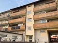 Gepflegtes Appartement mit Südwest-Dachterrasse und Bergblick - Außenansicht Mehrfamilienhaus