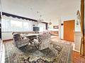 Vielseitiges Immobilien-Ensemble mit MFH, Bungalow und XXL-Halle in Brensbach! - Bungalow Wohnzimmer