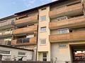 Gepflegtes Appartement mit Südwest-Dachterrasse und Bergblick - Außenansicht Mehrfamilienhaus