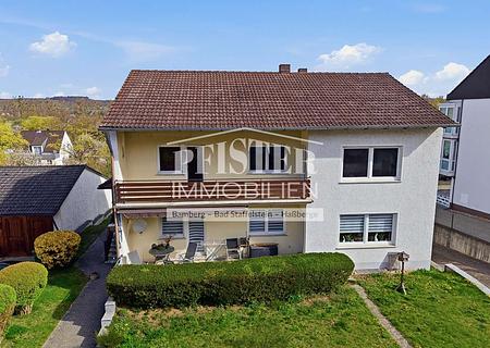 Ein Zuhause mit Zukunft: Zweifamilienhaus in Viereth mit großem Garten - Ansicht Balkon und Terrasse